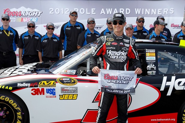 Kasey Kahne, driver of the #5 HendrickCars.com Chevrolet, poses after qualifying for the pole position at Talladega fall race 2012