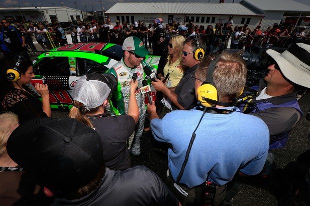 Dale Earnhardt Jr., driver of the #88 Diet Mountain Dew Chevrolet, speaks to the media after qualifying at Talladega fall race 2012