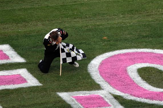 Parker Kligerman celebrated his first NASCAR Camping World Truck Series victory by taking the checkered flag and planting it in the infield at Talladega on Saturday.  Kligerman got a helpful push from Johnny Sauter and coasted home after the caultion