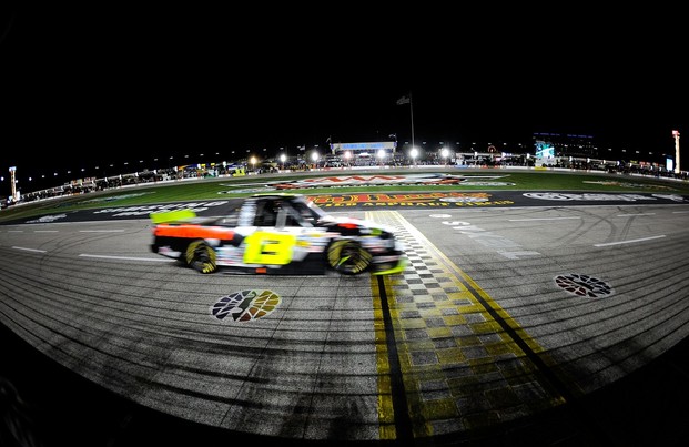 FORT WORTH, TX - NOVEMBER 02: Johnny Sauter, driver of the #13 SealMaster/Curb Records Toyota, crosses the finish line to win the NASCAR Camping World Truck Series WinStar World Casino 350k at Texas