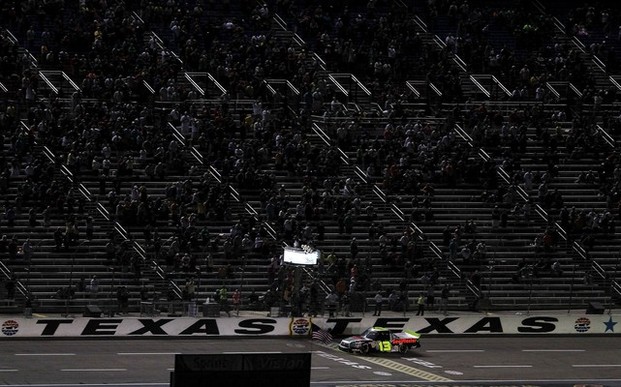 FORT WORTH, TX - NOVEMBER 02: Johnny Sauter, driver of the #13 SealMaster/Curb Records Toyota, crosses the finish line to win the NASCAR Camping World Truck Series WinStar World Casino 350k at Texas