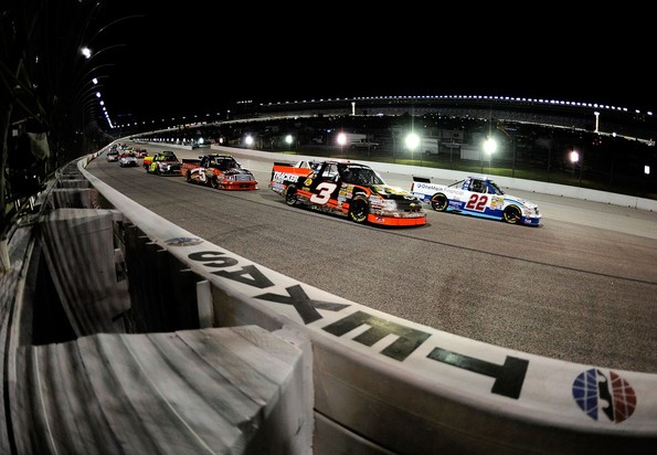 FORT WORTH, TX - NOVEMBER 02: Joey Coulter, driver of the #22 OneMain Financial Chevrolet, leads Ty Dillon, driver of the #3 Bass Pro Shops/Tracker Boats Chevrolet, to a restart during the NASCAR Camping World Truck Series WinStar World Casino 350k a