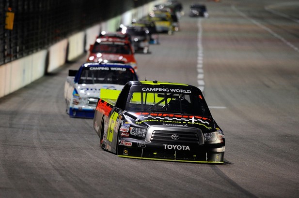 FORT WORTH, TX - NOVEMBER 02: Johnny Sauter, driver of the #13 SealMaster/Curb Records Toyota, leads a pack of trucks during the NASCAR Camping World Truck Series WinStar World Casino 350k at Texas