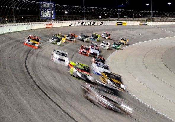 FORT WORTH, TX - NOVEMBER 02: Trucks race during the NASCAR Camping World Truck Series WinStar World Casino 350k at Texas