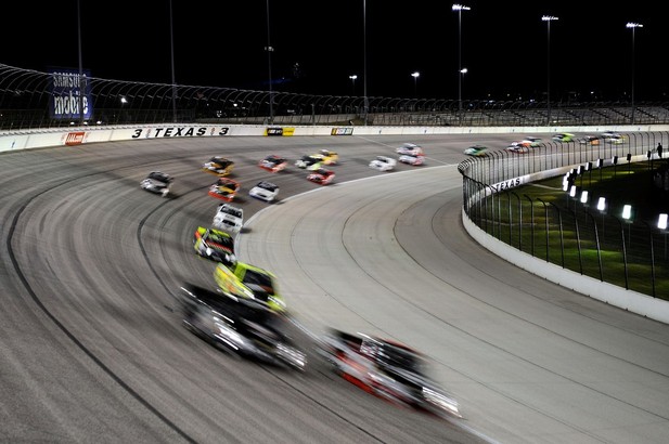 FORT WORTH, TX - NOVEMBER 02: Trucks race during the NASCAR Camping World Truck Series WinStar World Casino 350k at Texas
