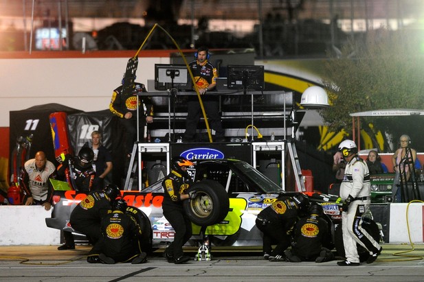 FORT WORTH, TX - NOVEMBER 02: Johnny Sauter pits the #13 SealMaster/Curb Records Toyota during the NASCAR Camping World Truck Series WinStar World Casino 350k at Texas