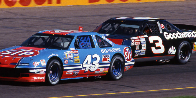 Richard Petty and Dale Earnhardt race each other at Phoenix in 1992. It marked the next-to-last race the two champions would compete against one another. Earnhardt finished 10th; Petty 22nd.
