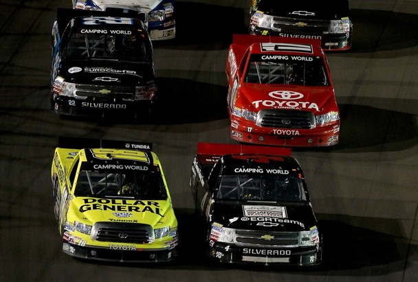 AVONDALE, AZ - NOVEMBER 09: Brian Scott, driver of the #18 Dollar General Toyota, and Kyle Larson, driver of the #4 Ganassi Earnhardt Racing Chevrolet, lead the field on the final restart during the NASCAR Camping World Truck Series Lucas Oil 150 at 