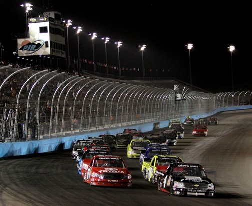 AVONDALE, AZ - NOVEMBER 09: Kyle Larson, driver of the #4 Ganassi Earnhardt Racing Chevrolet, leads the field during the NASCAR Camping World Truck Series Lucas Oil 150 at Phoenix International Raceway on November 9, 2012 in Avondale, Arizona.