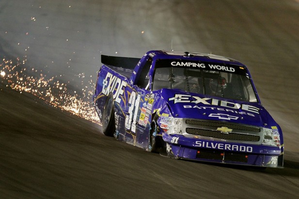 AVONDALE, AZ - NOVEMBER 09: James Buescher drives the #31 Exide Batteries Chevrolet with damage after making contact with a wall during the NASCAR Camping World Truck Series Lucas Oil 150 at Phoenix International Raceway on November 9, 2012 in Avonda