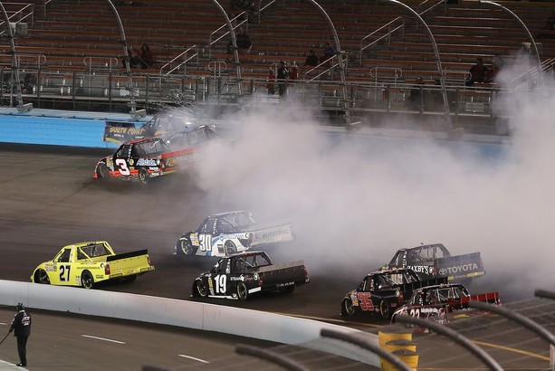 AVONDALE, AZ - NOVEMBER 09: Ty Dillon, driver of the #3 Bass Pro Shops/Tracker Boats Chevrolet, German Quiroga, driver of the #51 NET10 Wireless Toyota, and Brendan Gaughan, driver of the #2 South Point Hotel & Casino Chevrolet, make contact duri