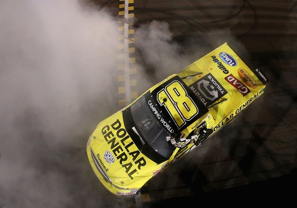 AVONDALE, AZ - NOVEMBER 09: Brian Scott, driver of the #18 Dollar General Toyota, performs a burnout after winning the NASCAR Camping World Truck Series Lucas Oil 150 at Phoenix International Raceway on November 9, 2012 in Avondale, Arizona.