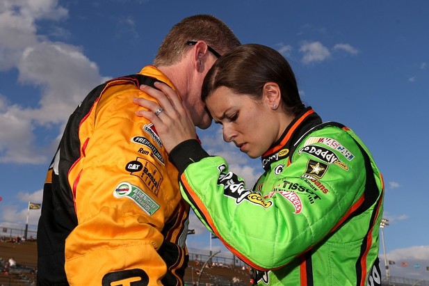 AVONDALE, AZ - NOVEMBER 09: (L-R) Jeff Burton, driver of the #31 Caterpillar Chevrolet, talks to Danica Patrick, driver of the #10 GoDaddy.com Chevrolet, on the gird during qualifying for the NASCAR Sprint Cup Series AdvoCare 500 at Phoenix Internati