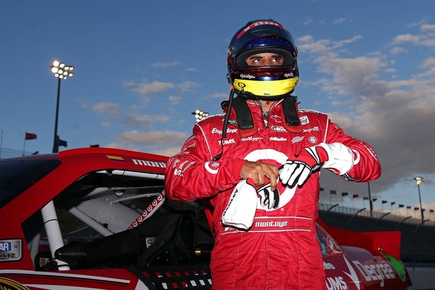 AVONDALE, AZ - NOVEMBER 09: Juan Pablo Montoya, driver of the #42 Target Chevrolet, stands on the grid after qualifying for the NASCAR Sprint Cup Series AdvoCare 500 at Phoenix International Raceway on November 9, 2012 in Avondale, Arizona. 
