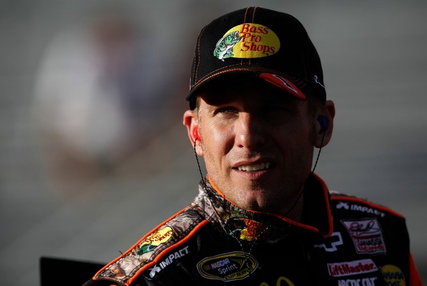 AVONDALE, AZ - NOVEMBER 09: Jamie McMurray, driver of the #1 Bass Pro Shops/Allstate Chevrolet, stands on the grid during qualifying for the NASCAR Sprint Cup Series AdvoCare 500 at Phoenix International Raceway on November 9, 2012 in Avondale, Arizo
