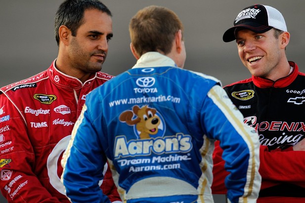 AVONDALE, AZ - NOVEMBER 09: (L-R) Juan Pablo Montoya, driver of the #42 Target Chevrolet, talks with Mark Martin, driver of the #55 Aaron's Dream Machine Toyota, and Regan Smith, driver of the #51 Phoenix Construction Chevrolet, on the grid duri