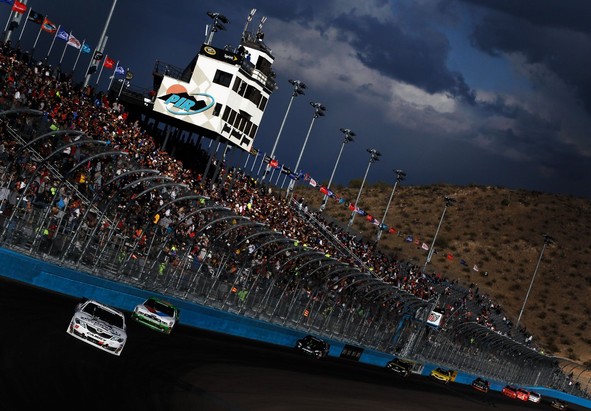 Joey Logano, driver of the #18 GameStop/Epic Mickey2 Toyota, leads the field during the NASCAR Nationwide Series Great Clips 200 at Phoenix