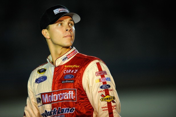 Trevor Bayne, driver of the #21 Motorcraft/Quick Lane Tire & Auto Center Ford, stands on the grid during qualifying for the NASCAR Sprint Cup Series Ford EcoBoost 400 at Homestead