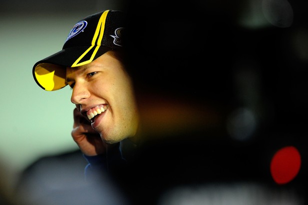 Brad Keselowski, driver of the #2 Miller Lite Dodge, smiles on the grid during qualifying for the NASCAR Sprint Cup Series Ford EcoBoost 400 at Homestead