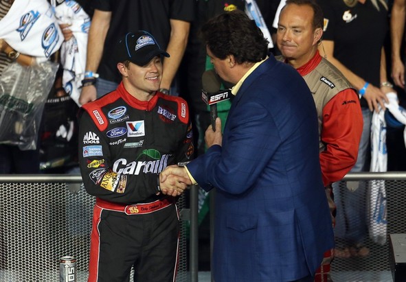 Ricky Stenhouse Jr. (L), driver of the #6 Cargill Ford, shakes hands with NASCAR President Mike Helton (R) in Champions Victory Lane after winning the series championship and finishing sixth in the NASCAR Nationwide Series Ford EcoBoost 300 at Homest