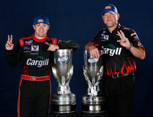 Ricky Stenhouse Jr., driver of the #6 Cargill Ford, and crew chief Mike Kelley pose on the track after winning back-to-back Nationwide series championships after competing in the NASCAR Nationwide Series Ford EcoBoost 300 at Homestead