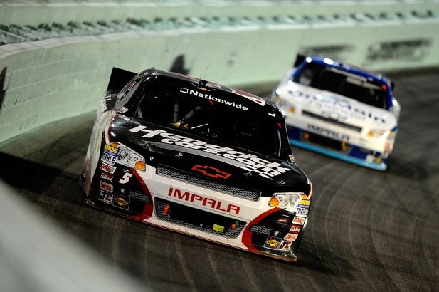 Regan Smith, driver of the #5 HendrickCars.com Chevrolet, leads Elliott Sadler, driver of the #2 OneMain Financial Chevrolet, during the NASCAR Nationwide Series Ford EcoBoost 300 at Homestead