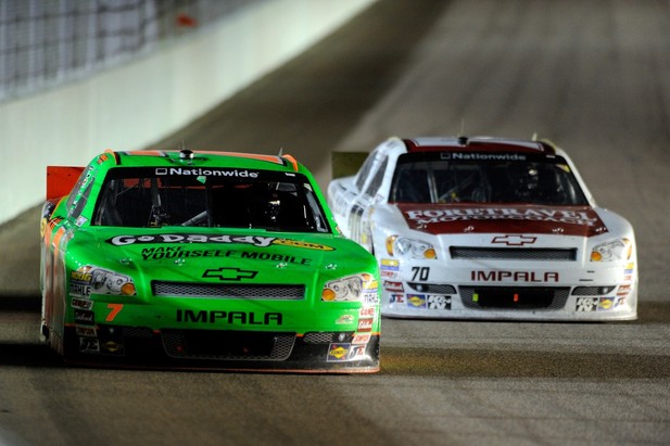 Danica Patrick, driver of the #7 GoDaddy.com Chevrolet, leads Johanna Long, driver of the #70 Foretravel Motorcoach Chevrolet, during the NASCAR Nationwide Series Ford EcoBoost 300 at Homestead