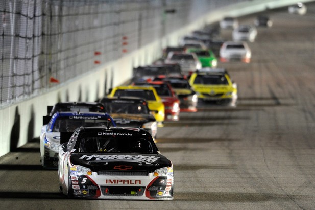 Regan Smith, driver of the #5 HendrickCars.com Chevrolet, leads Elliott Sadler, driver of the #2 OneMain Financial Chevrolet, during the NASCAR Nationwide Series Ford EcoBoost 300 at Homestead
