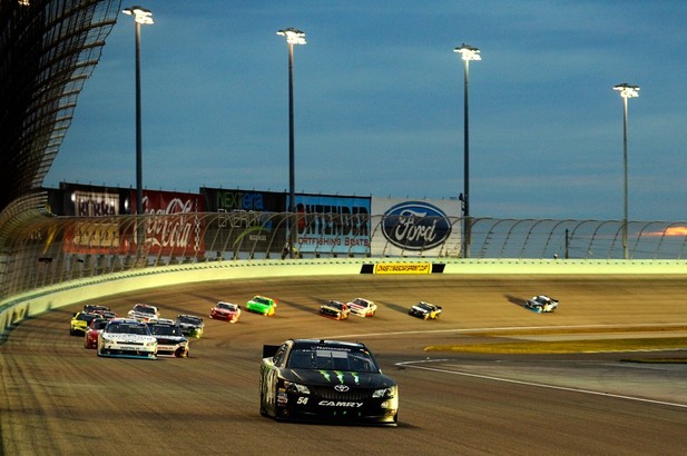 Kyle Busch, driver of the #54 Monster Energy Toyota, leads the field during the NASCAR Nationwide Series Ford EcoBoost 300 at Homestead
