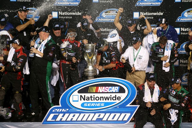 Ricky Stenhouse Jr., driver of the #6 Cargill Ford, celebrates in Champions Victory Lane after winning the series championship and finishing sixth in the NASCAR Nationwide Series Ford EcoBoost 300 at Homestead