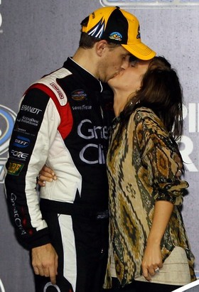 James Buescher, driver of the #31 Great Clips Chevrolet, kisses his wife Kris in Champions Victory Lane after winning the Series Championship and finishing in thirteenth place in the NASCAR Camping World Truck Series Ford EcoBoost 200 at Homestead