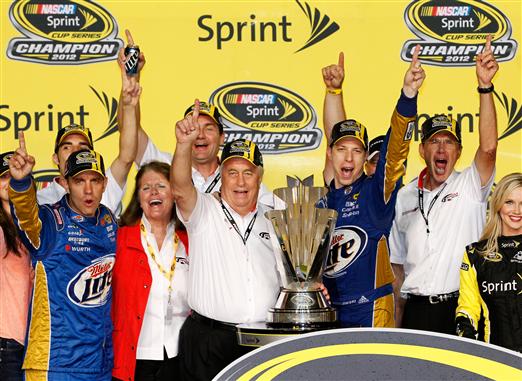 Brad Keselowski and team owner Roger Penske clinched their first NASCAR Sprint Cup championships after Keselowski's 16th place finish in the 