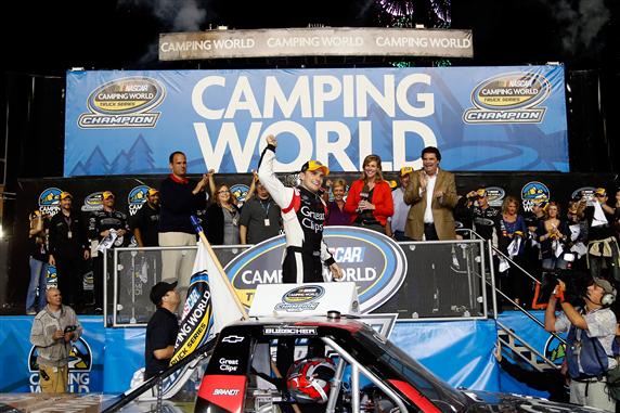 James Buescher celebrates after winning the 2012 Camping World Truck Series championship at Homestead on Friday.  Buescher's 13th place finish in the 