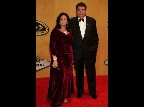 NASCAR President Mike Helton and wife Lynda arrive on the red carpet for the NASCAR Sprint Cup Series Champion's Awards at the Wynn Las Vegas on November 30, 2012