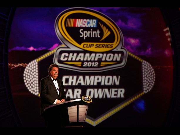  NASCAR President Mike Helton speaks on stage during the NASCAR Sprint Cup Series Champion's Awards Ceremony at the Wynn Las Vegas on November 30, 2012