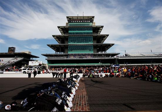 Brickyard race winners: Jimmie Johnson and #48 crew kissing the Brick-Yard
