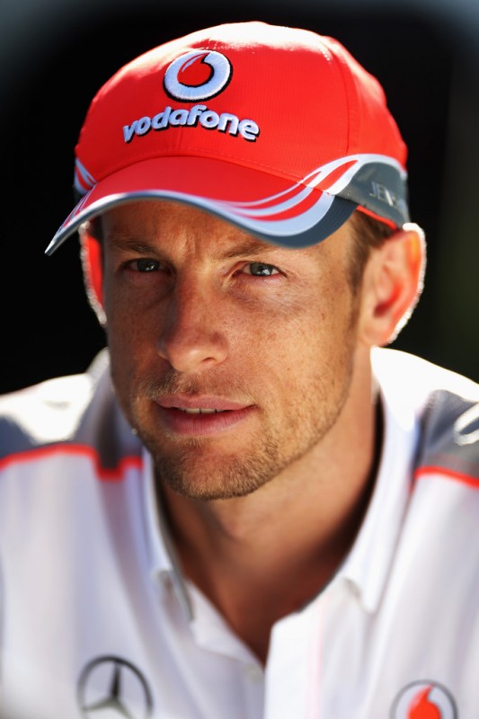 Jenson Button of Great Britain and McLaren is interviewed by the media during previews to the Australian Formula One Grand Prix.