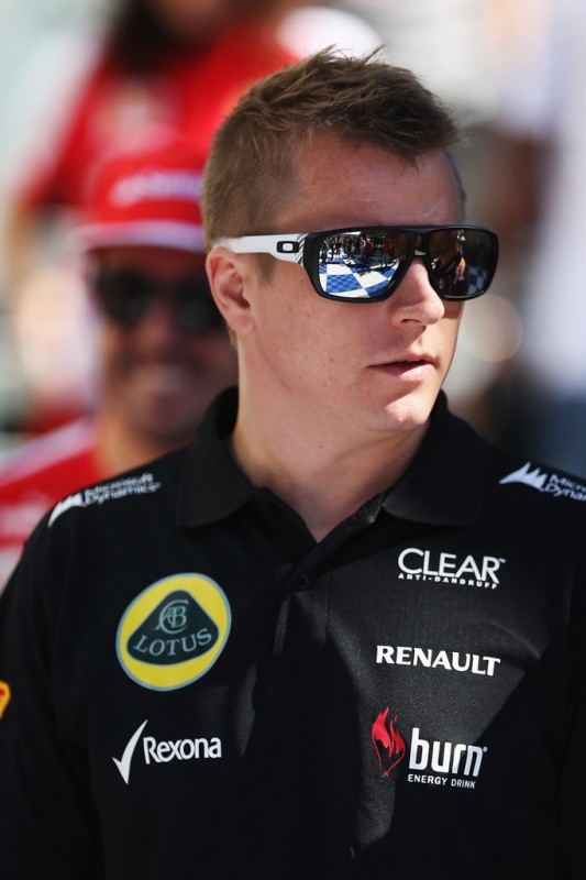 Kimi Raikkonen of Finland and Lotus walks in the paddock during previews to the Australian Formula One Grand Prix at the Albert Park Circuit on March 14, 2013 in Melbourne, Australia.