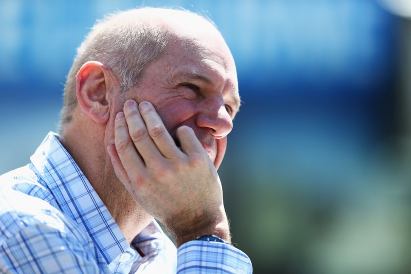 Red Bull Racing Chief Technical Officer Adrian Newey talks in the paddock during previews to the Australian Formula One Grand Prix at the Albert Park Circuit on March 14, 2013 in Melbourne, Australia.