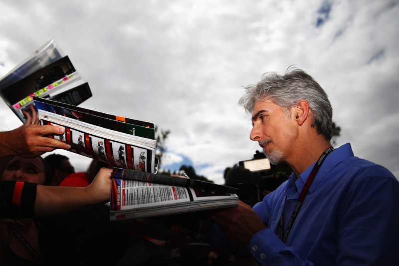 Former F1 World Champion Damon Hill signs autographs during previews to the Australian Formula One Grand Prix at the Albert Park Circuit on March 14, 2013 in Melbourne, Australia.