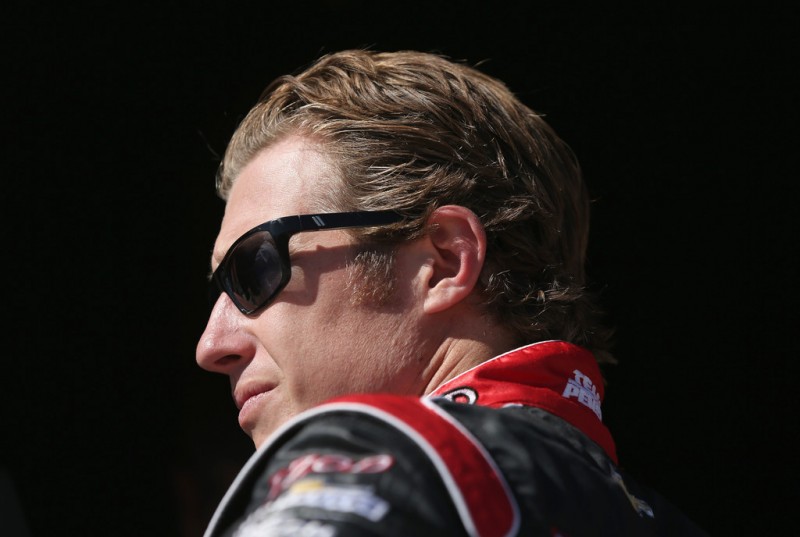 Ryan Briscoe of Australia and driver of the Team Penske Dallara Chevrolet looks on during qualifying for the IZOD IndyCarSeries MATV 500 World Championship at the Auto Club Speedway on September 14, 2012 in Fontana, California.
