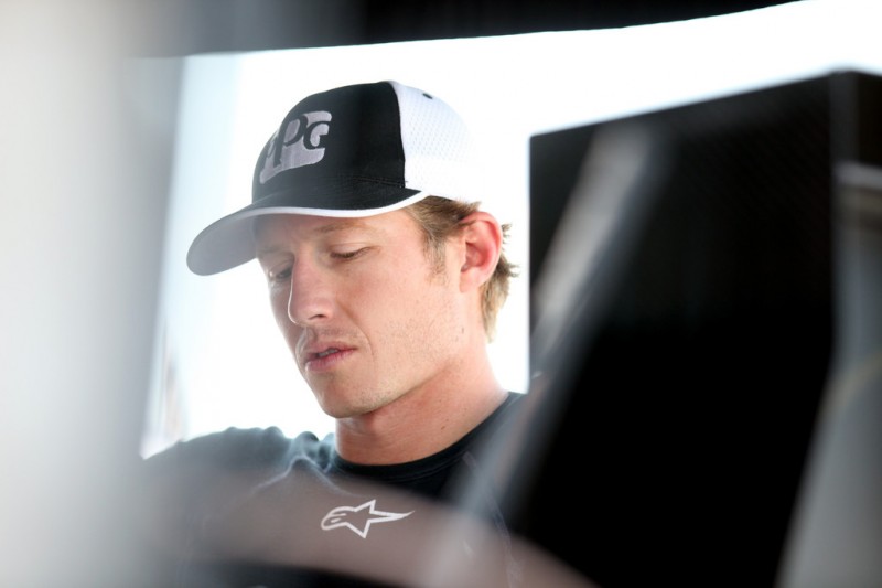 Ryan Briscoe of Australia driver of the #2 PPG Automotive Finishes Team Penske Chevy Dallara sits in his pit box during practice for the Honda Indy 200 at Mid Ohio on August 3, 2012 in Lexington, United States.