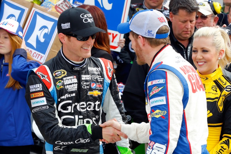 Kasey Kahne, driver of the #5 Great Clips Chevrolet, speaks with Dale Earnhardt Jr., driver of the #88 National Guard Chevrolet, in victory lane after winning the NASCAR Sprint Cup Series Food City 500 at Bristol Motor Speedway on March 17, 2013 in B