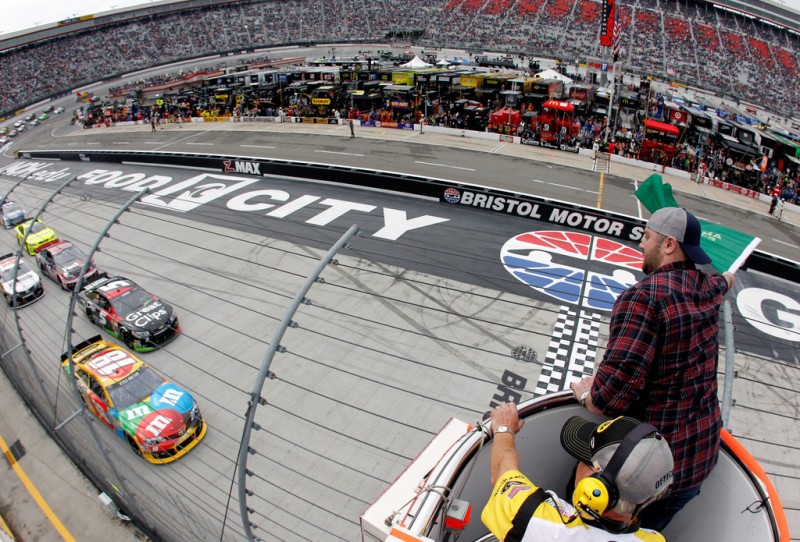 Kyle Busch, driver of the #18 M&M's Toyota, and Kasey Kahne, driver of the #5 Great Clips Chevrolet, lead the field to the green flag to start the NASCAR Sprint Cup Food City 500 at Bristol Motor Speedway on March 17, 2013 in Bristol, Tennes
