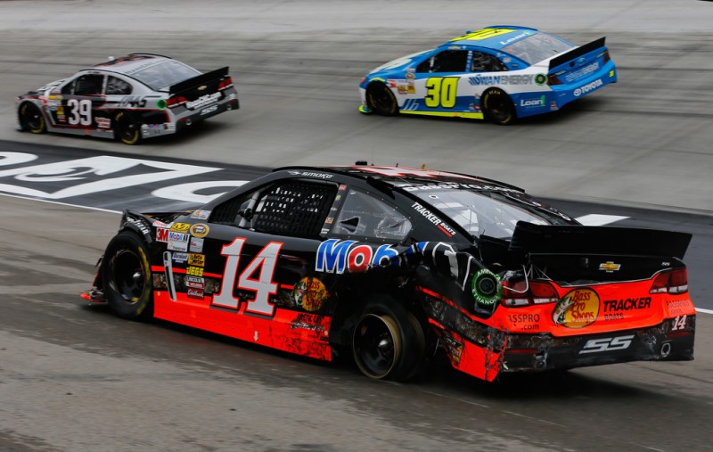 Tony Stewart drives the wrecked #14 Bass Pro Shops/Mobil 1 Chevrolet after cutting a tire early during the NASCAR Sprint Cup Food City 500 at Bristol Motor Speedway on March 17, 2013 in Bristol, Tennessee. 