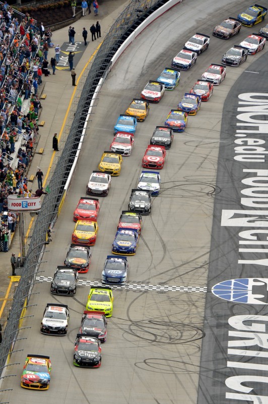 Kyle Busch, driver of the #18 M&M's Toyota, and Kasey Kahne, driver of the #5 Great Clips Chevrolet, lead the field to start the NASCAR Sprint Cup Food City 500 at Bristol Motor Speedway on March 17, 2013 in Bristol, Tennessee. 