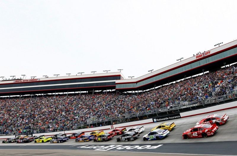 Kyle Busch, driver of the #18 M&M's Toyota, and Kasey Kahne, driver of the #5 Great Clips Chevrolet, lead the field to the green flag to start the NASCAR Sprint Cup Series Food City 500 at Bristol Motor Speedway on March 17, 2013 in Bristol,