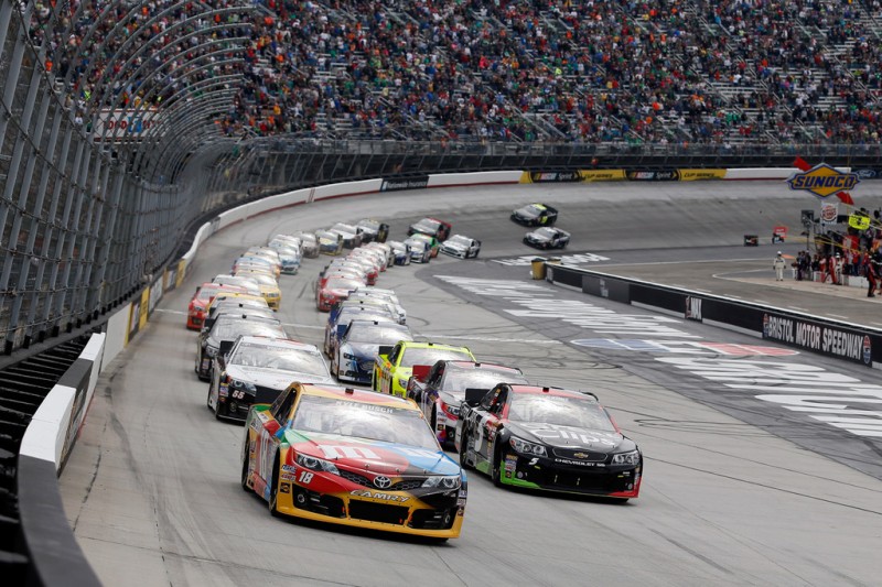 Kyle Busch, driver of the #18 M&M's Toyota, and Kasey Kahne, driver of the #5 Great Clips Chevrolet, lead the field to start the NASCAR Sprint Cup Series Food City 500 at Bristol Motor Speedway on March 17, 2013 in Bristol, Tennessee. 