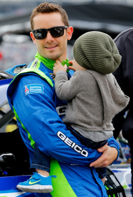 Casey Mears, driver of the #13 GEICO Ford, holds his son Hayden on the grid prior to the NASCAR Sprint Cup Series Food City 500 at Bristol Motor Speedway on March 17, 2013 in Bristol, Tennessee. 
