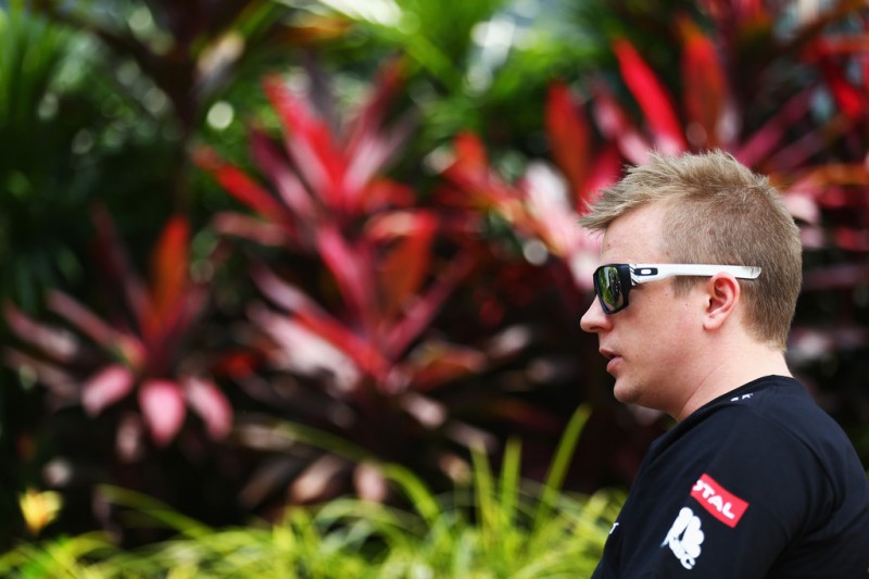 Kimi Raikkonen of Finland and Lotus is interviewed by the media during previews to the Malaysian Formula One Grand Prix at the Sepang Circuit on March 21, 2013 in Kuala Lumpur, Malaysia.
